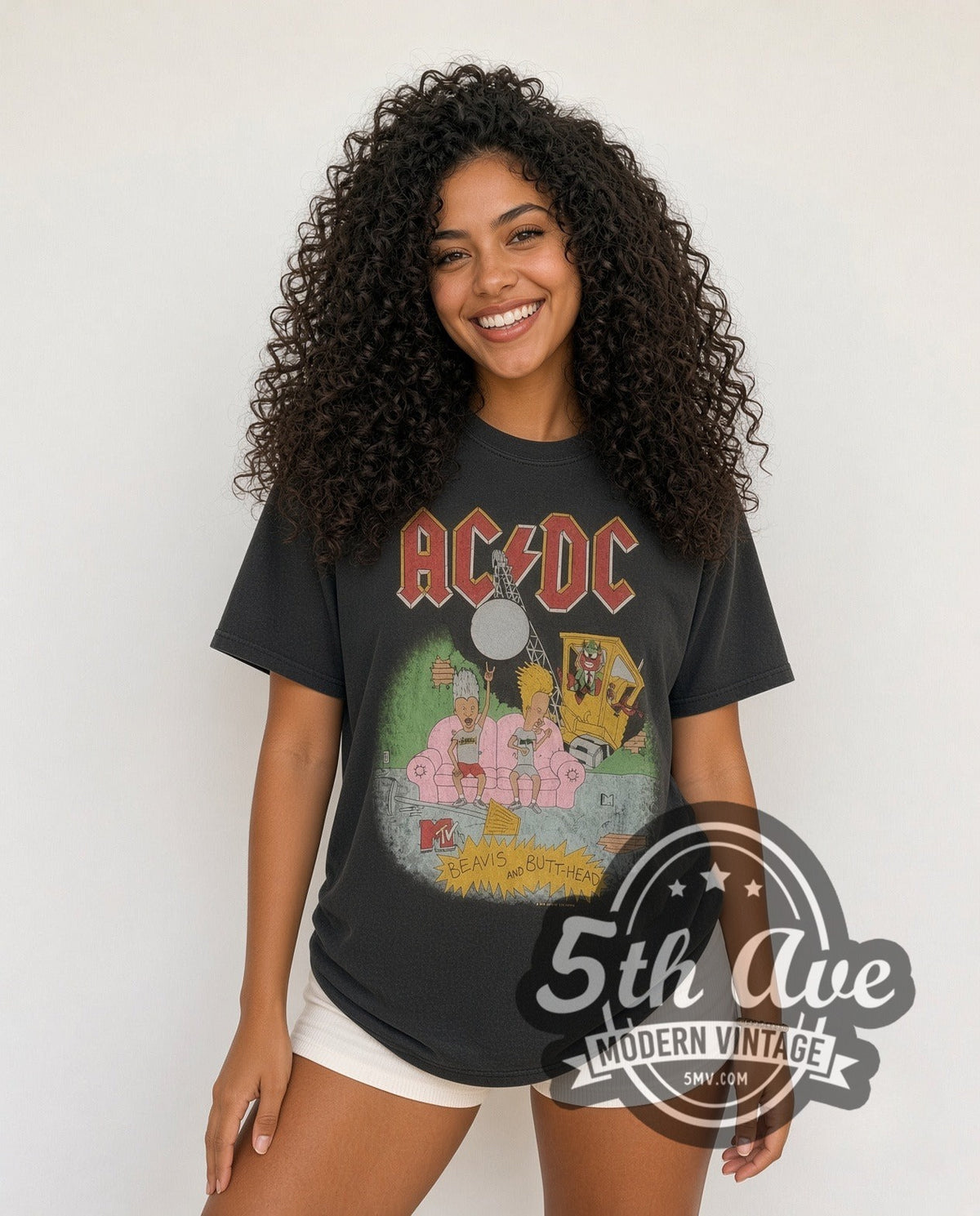 Model wearing the AC/DC x Beavis and Butt-Head Pink Couch MTV Washed vintage band t-shirt in black