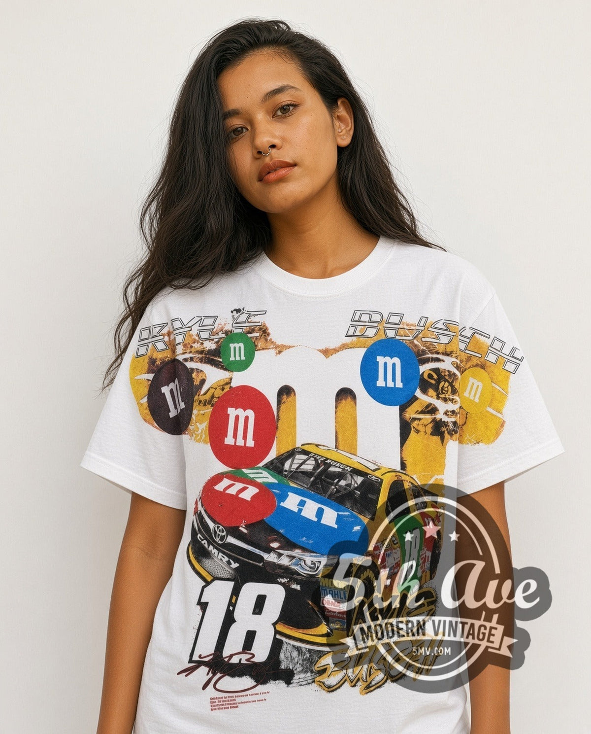 Model wearing the NASCAR Kyle Busch #18 M&M's Characters all-over-print vintage NASCAR t-shirt in white