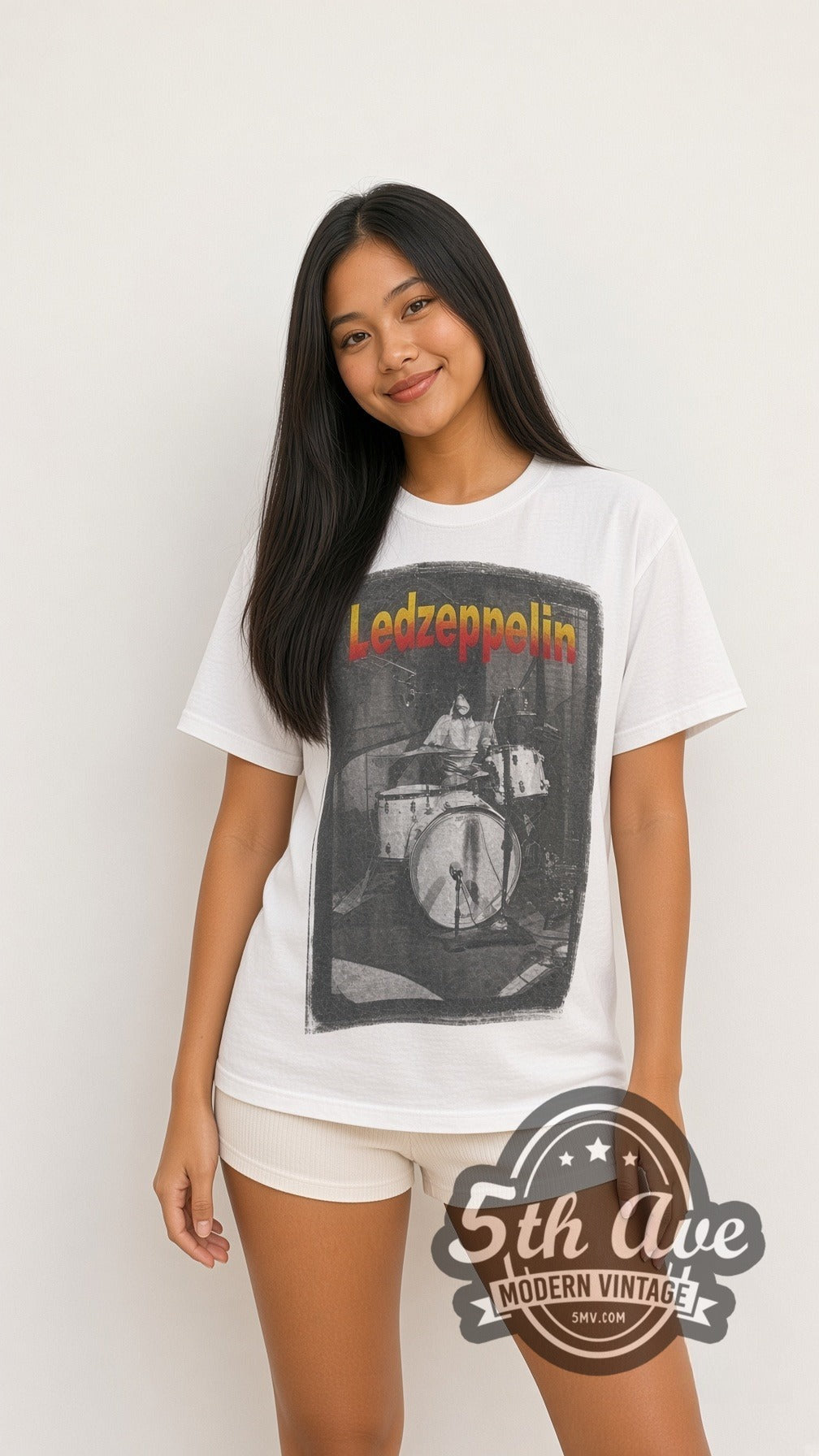 Model wearing the Led Zeppelin Drummer Tribute vintage band t-shirt in white