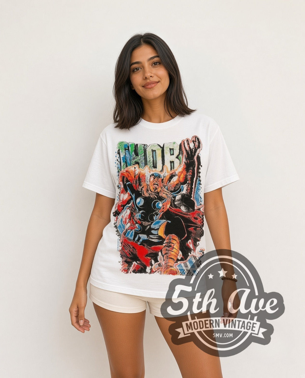 Model wearing the Marvel Thor Comic Action all-over-print vintage cartoon t-shirt in white