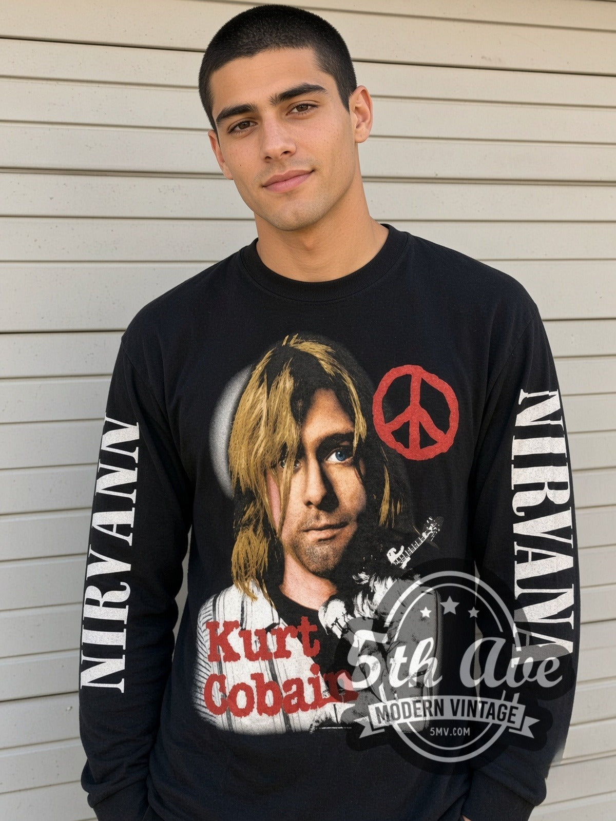 Model wearing the Nirvana Kurt Cobain Peace Sign vintage band long sleeve t-shirt