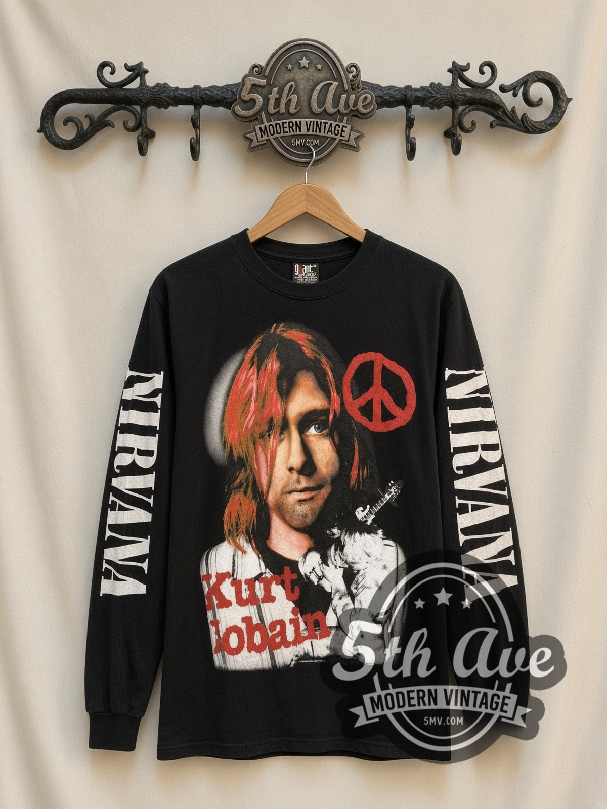 Nirvana Kurt Cobain Peace Sign vintage band long sleeve t-shirt, front view on a display rack