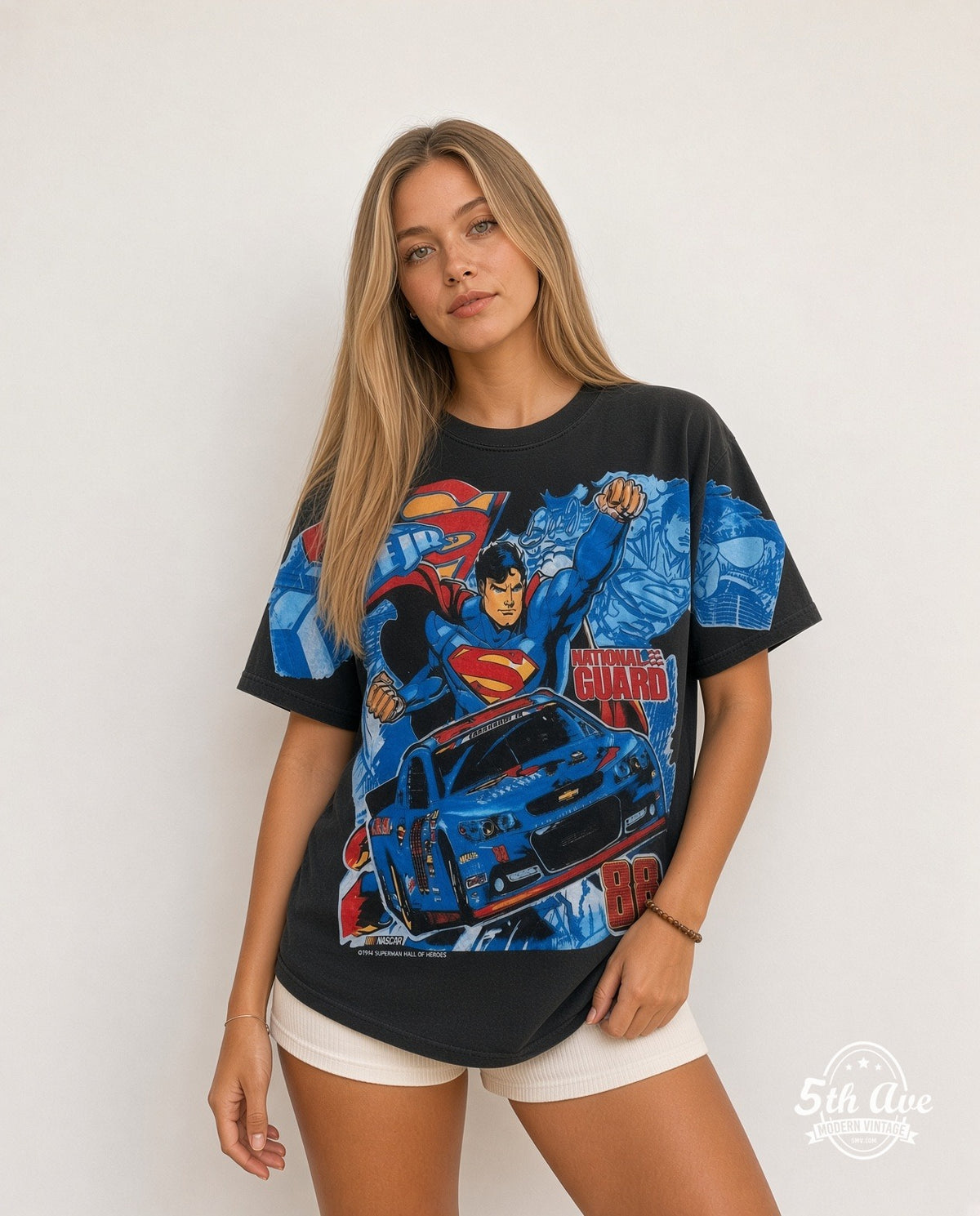 Model wearing the NASCAR Superman & Dale Earnhardt Jr. #88 National Guard all-over-print NASCAR t-shirt in black