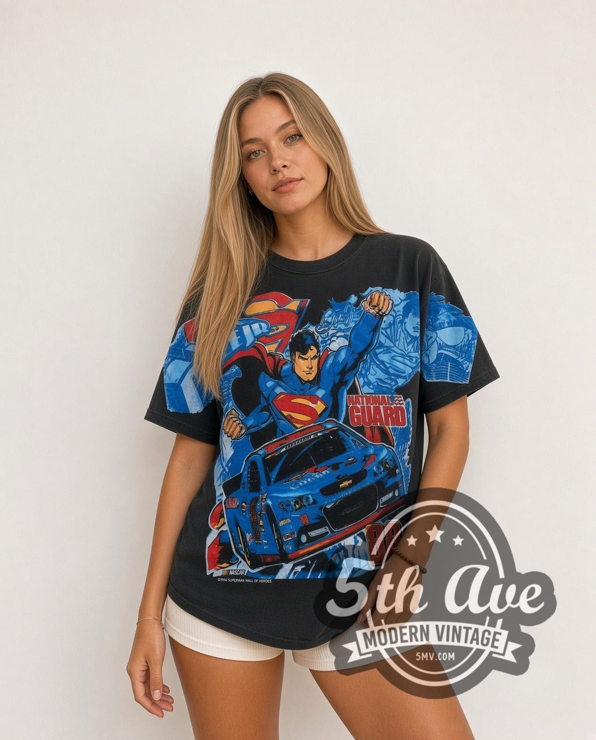 Model wearing the NASCAR Superman & Dale Earnhardt Jr. #88 National Guard all-over-print vintage NASCAR t-shirt in black