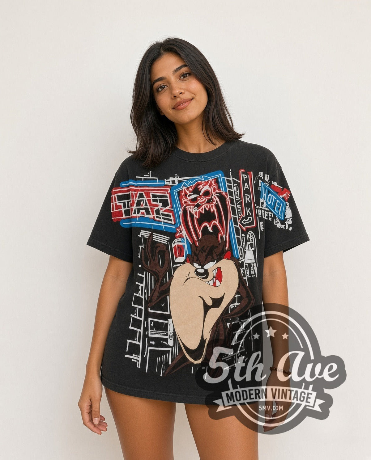 Model wearing the Looney Tunes Taz Graffiti Street all-over-print vintage cartoon t-shirt in black