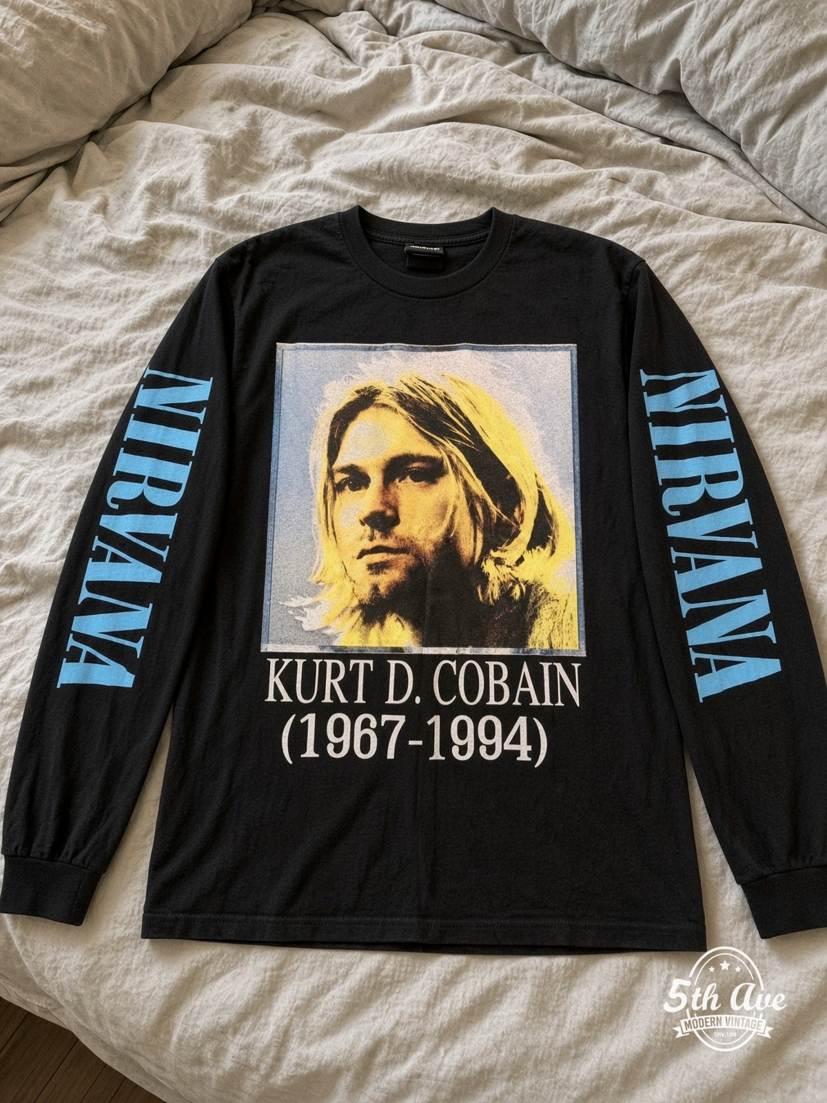 ETS LS 25 Nirvana Kurt D. Cobain 1967-1994 Portrait long sleeve vintage tee laid on a bed