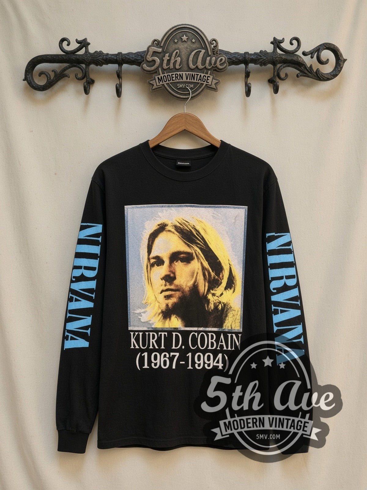 Nirvana Kurt D. Cobain 1967-1994 Portrait vintage band long sleeve t-shirt, front view on a display rack