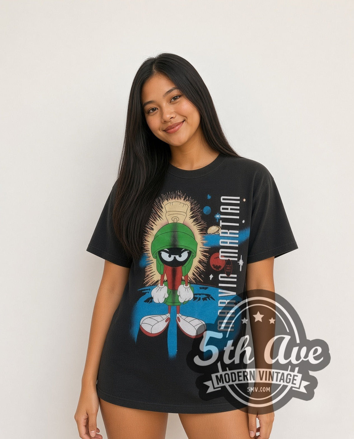 Model wearing the Looney Tunes Marvin the Martian Portrait all-over-print vintage cartoon t-shirt in black