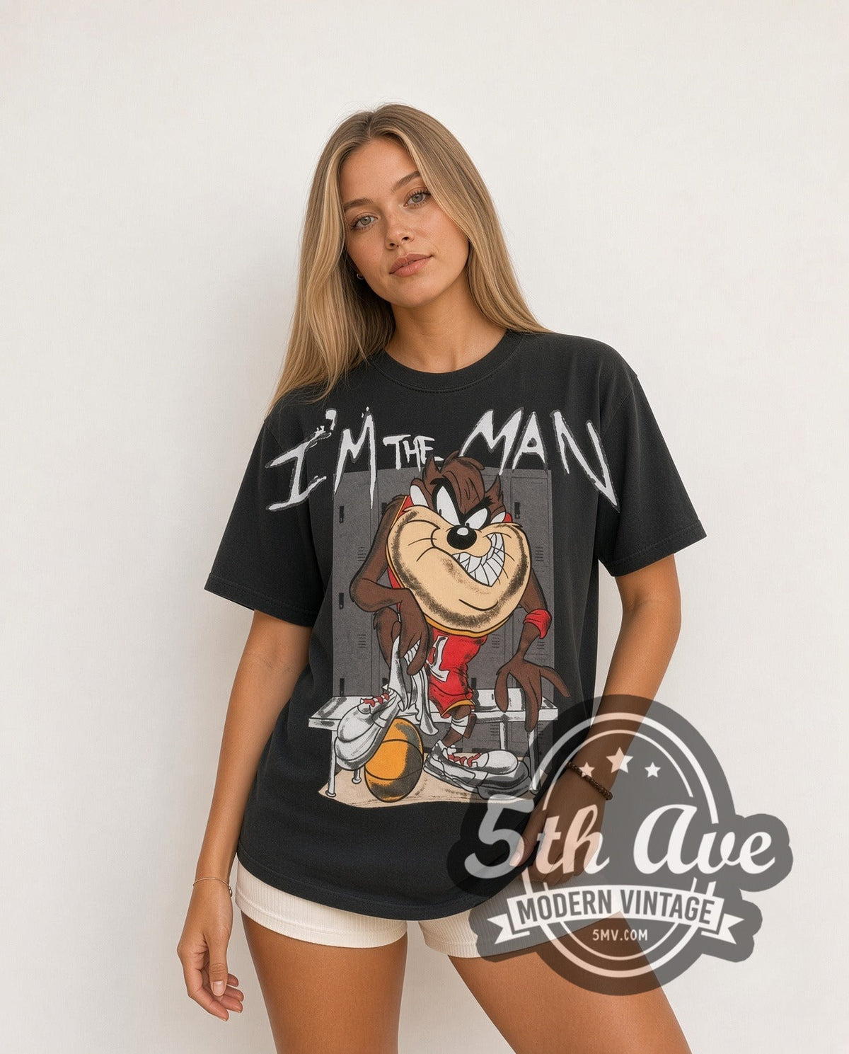 Model wearing the Looney Tunes Taz I'm The Man Basketball all-over-print vintage cartoon t-shirt in black