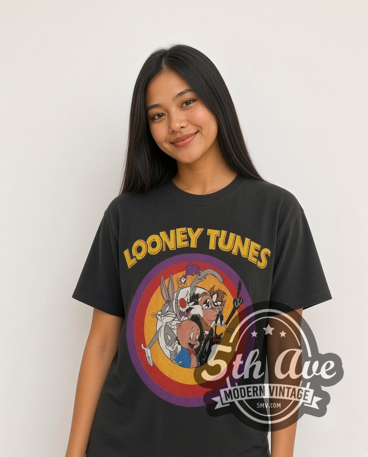 Model wearing the Looney Tunes Circle Badge Group all-over-print vintage cartoon t-shirt in black