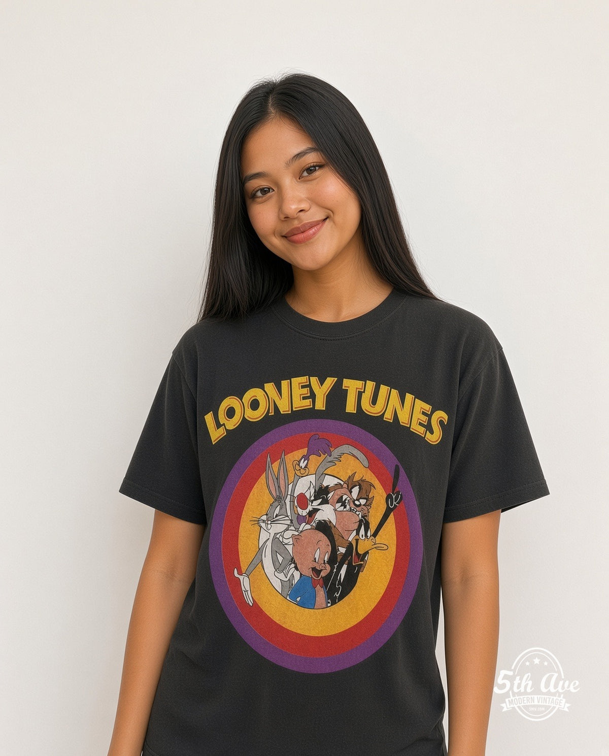 Model wearing Looney Tunes Circle Badge Group Black vintage cartoon tee