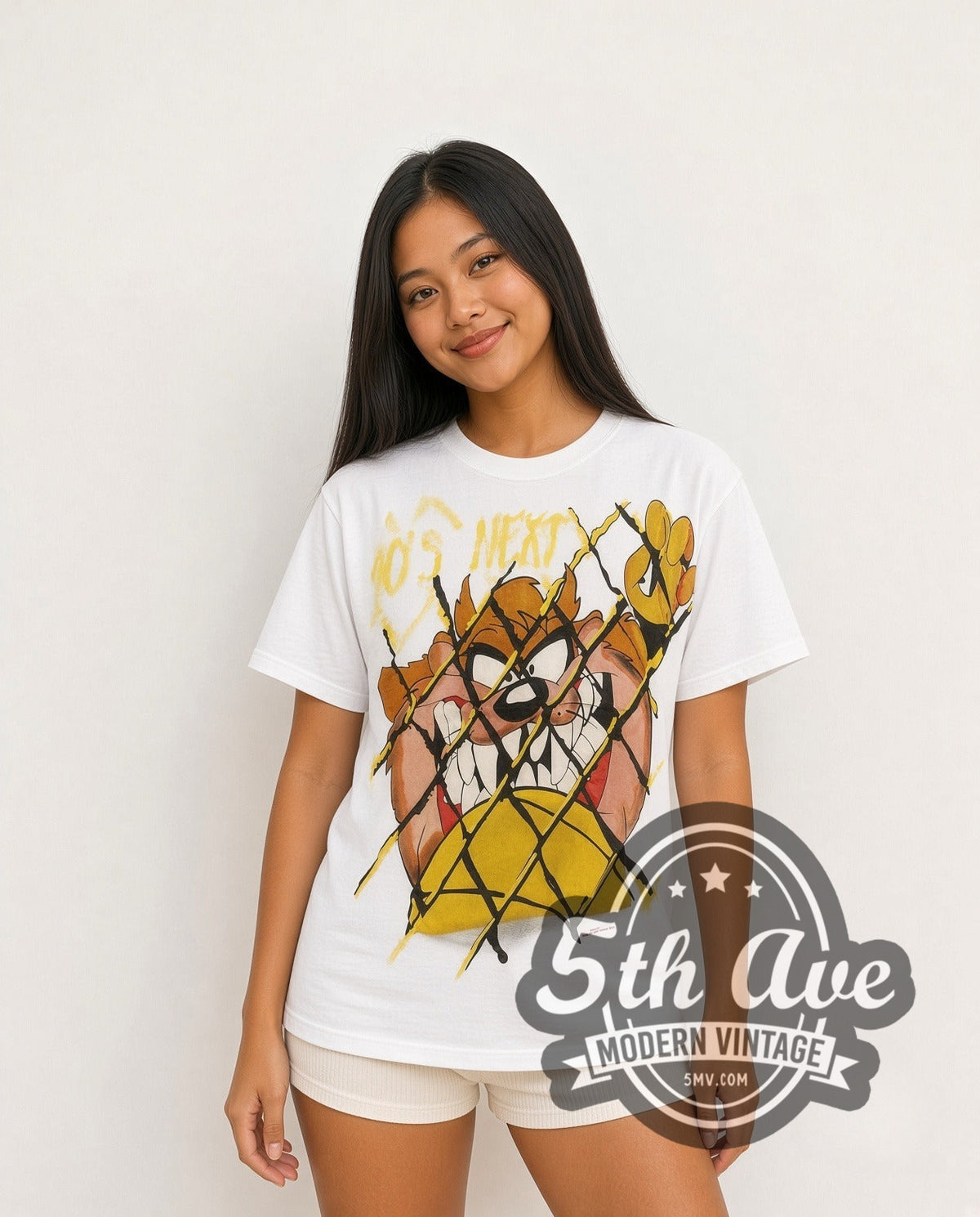 Model wearing the Looney Tunes Taz Who's Next all-over-print vintage cartoon t-shirt in white