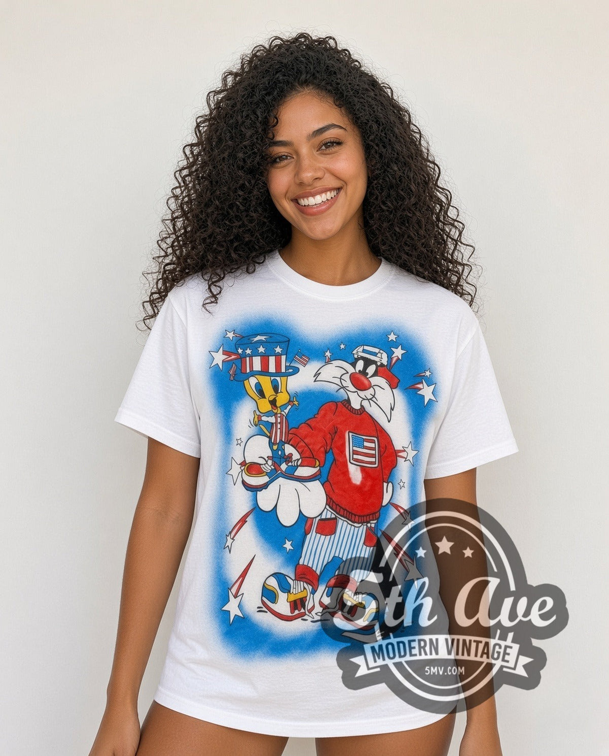 Model wearing the Looney Tunes Sylvester Uncle Sam Patriotic all-over-print vintage cartoon t-shirt in white
