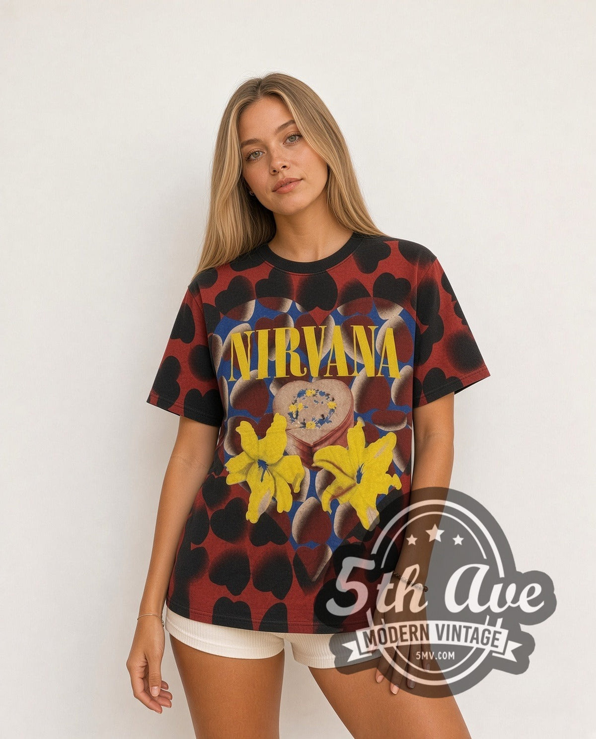 Model wearing the Nirvana Heart Lilies all-over-print vintage band t-shirt in black