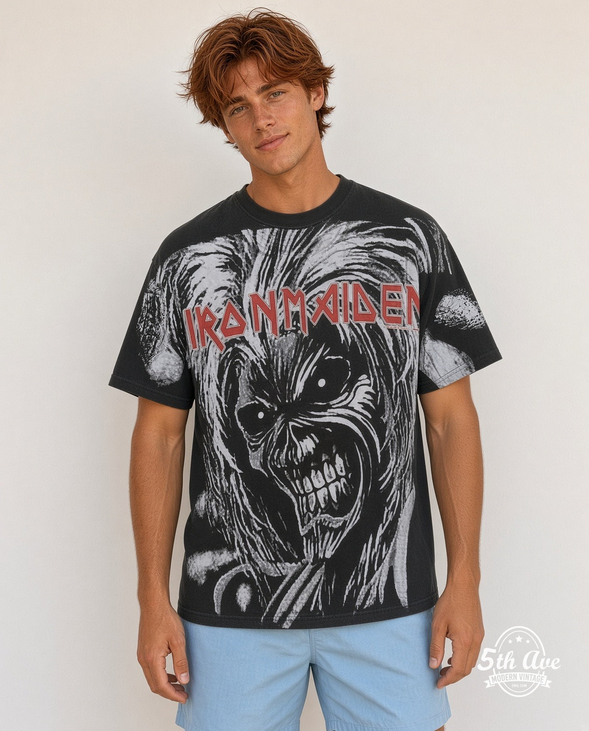 Model wearing Iron Maiden Eddie Face black all over print vintage band tee