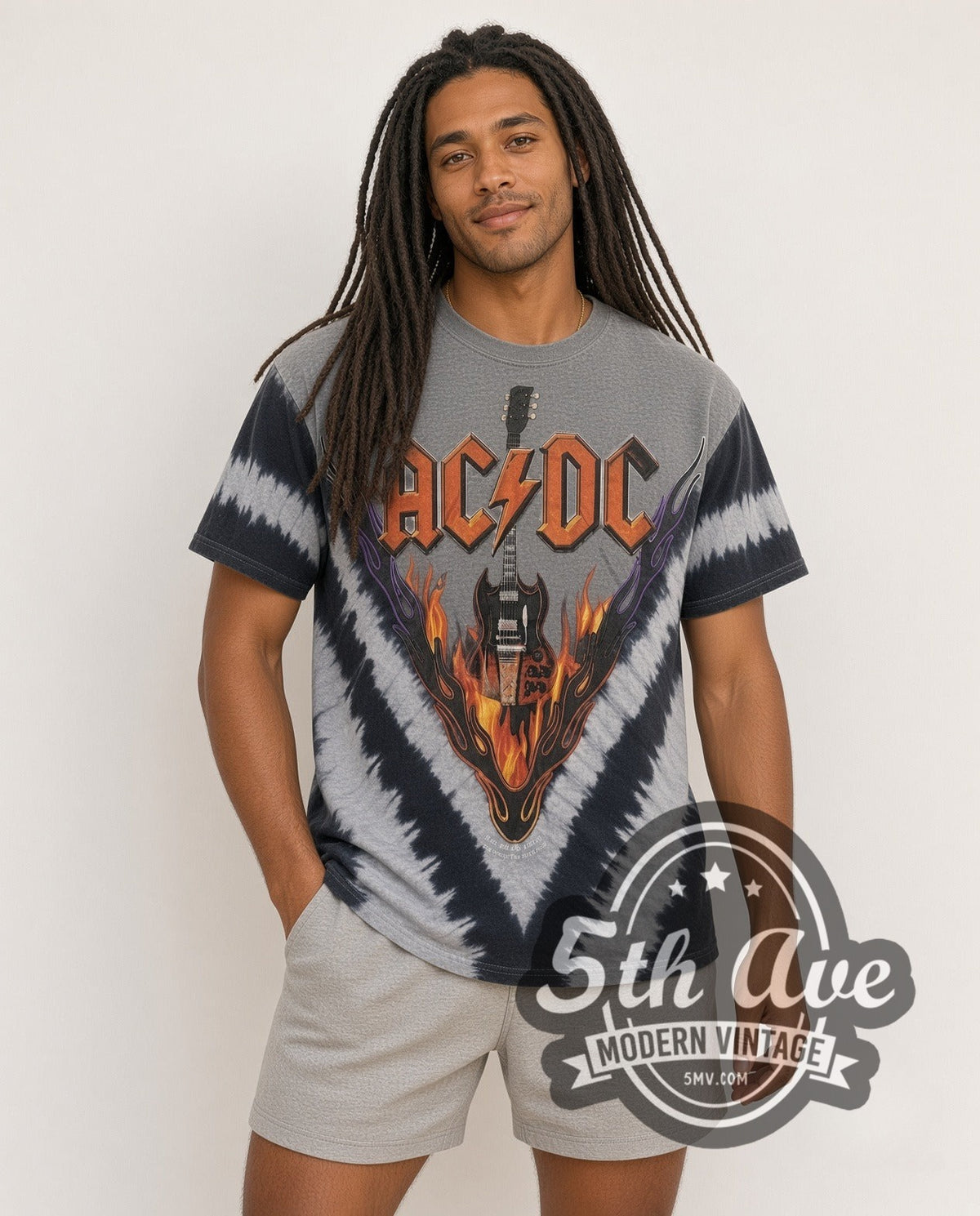 Model wearing AC/DC Flaming Winged Guitar Tie-Dye V Grey vintage band tee