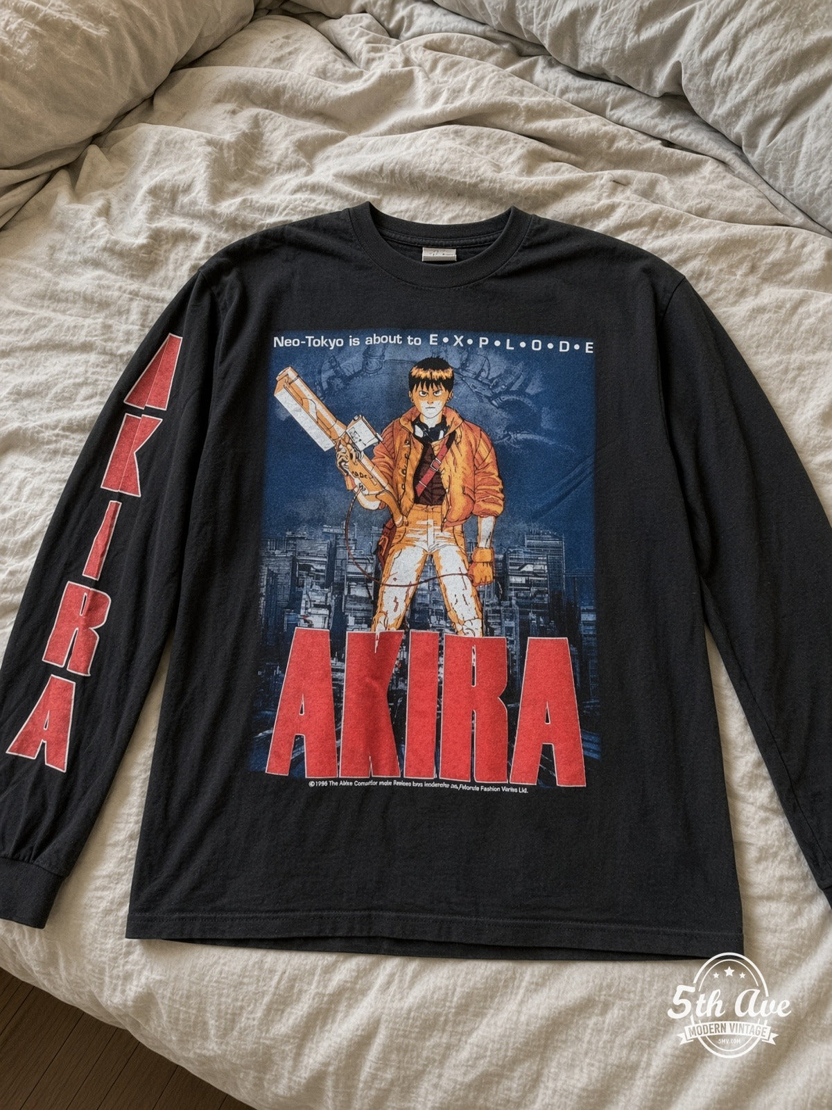 ETS LS 36 Akira Kaneda long sleeve vintage tee laid on a bed