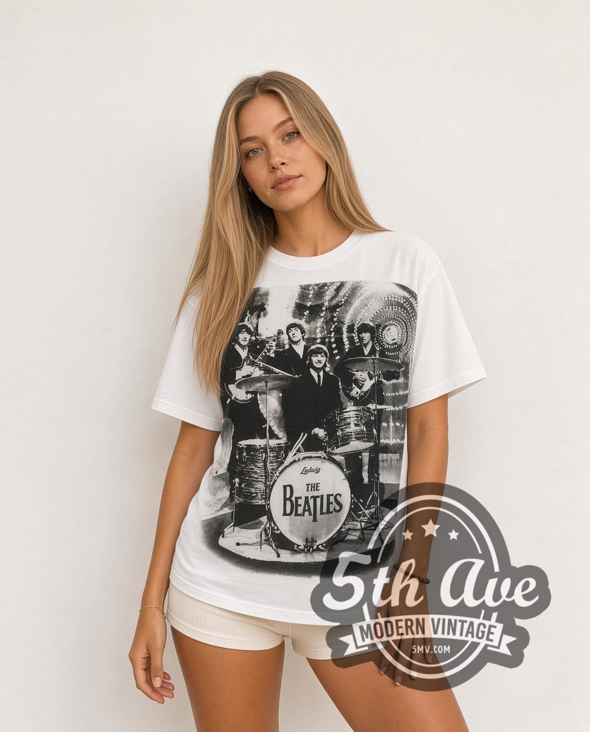 Model wearing The Beatles Montage Drums all-over-print vintage band t-shirt in white