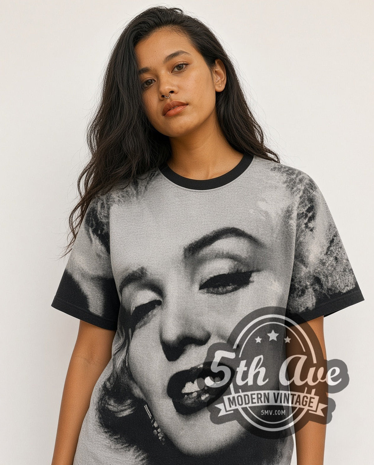 Model wearing the Marilyn Monroe Face Closeup all-over-print vintage graphic tee in black