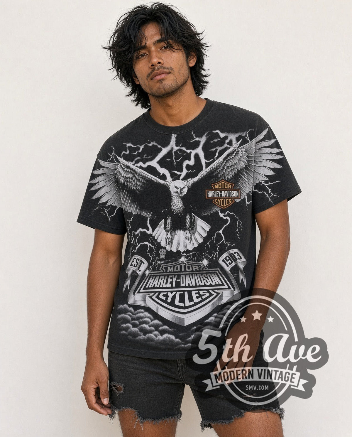 Model wearing the Harley-Davidson Eagle Lightning EST 1903 all-over-print vintage Harley tee in black