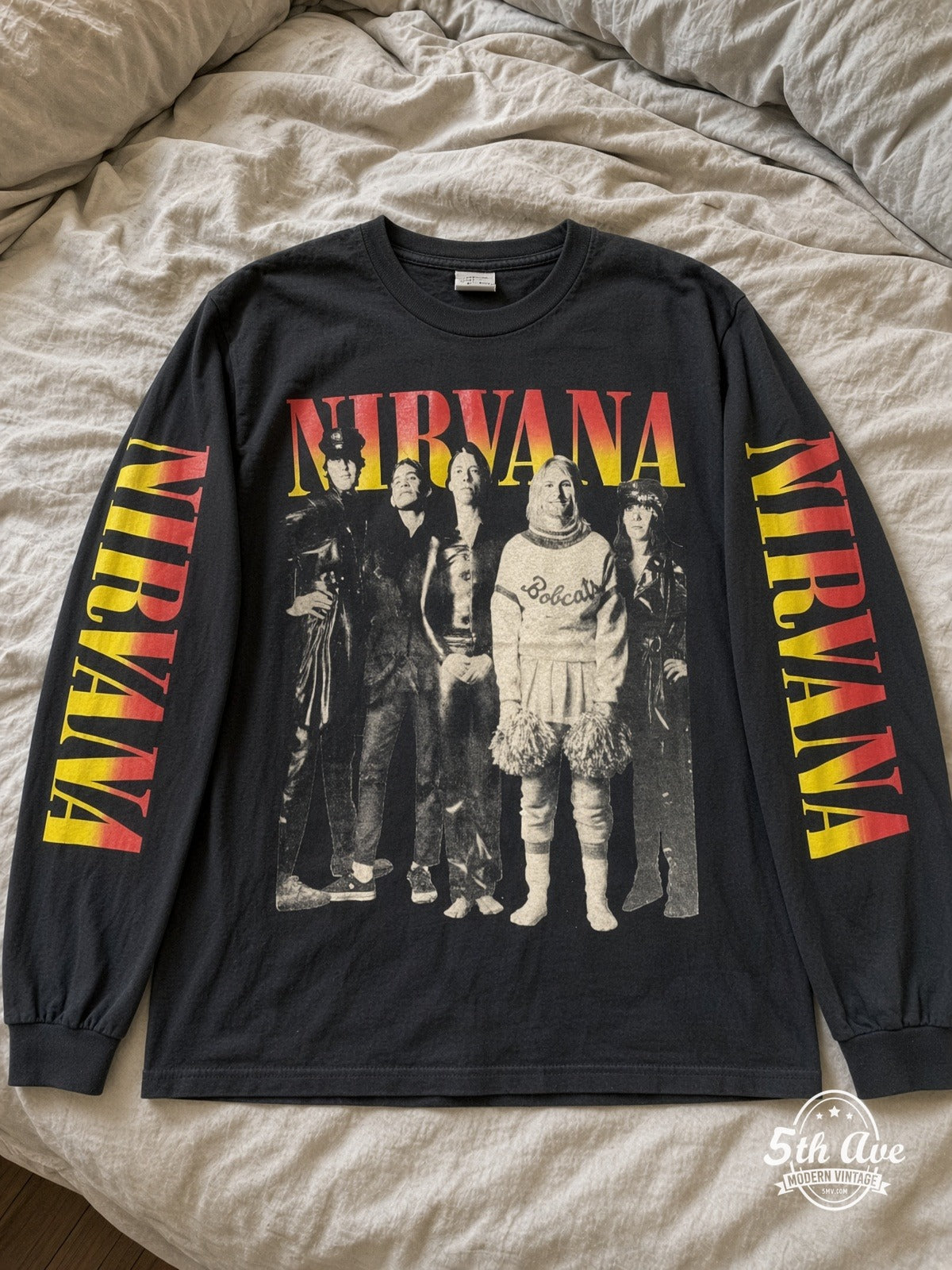 ETS LS 44 Nirvana Bobcats Photo long sleeve vintage tee laid on a bed