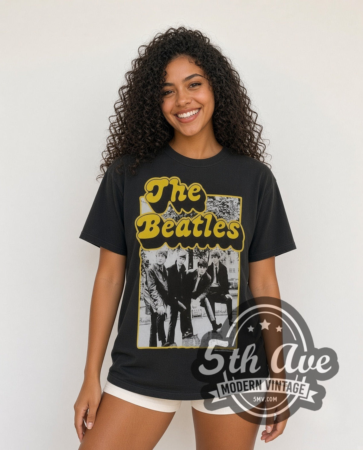 Model wearing The Beatles Cartoon Band vintage band t-shirt in black