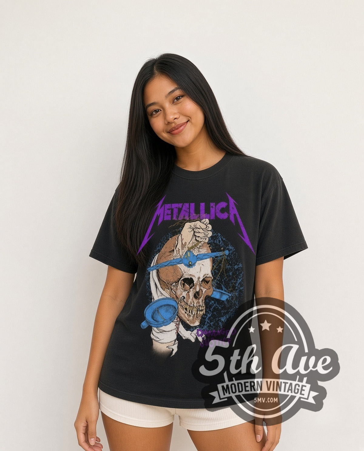 Model wearing the Metallica Damaged Justice Skull Scales vintage band t-shirt in black