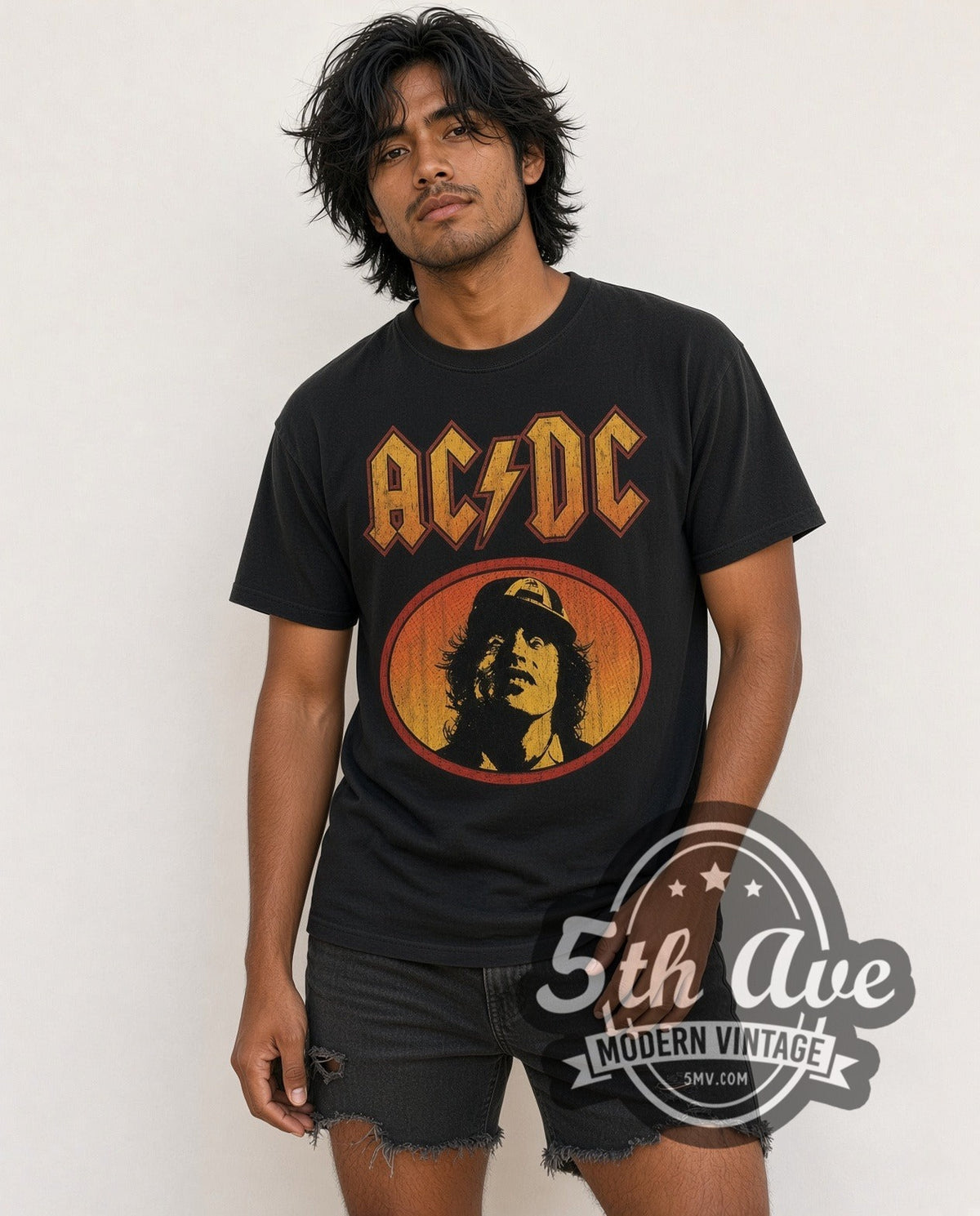 Model wearing the AC/DC Angus Young Oval vintage band t-shirt in black