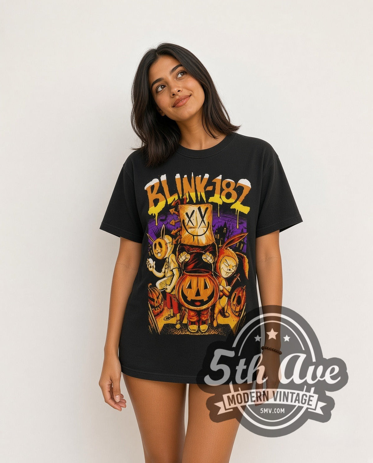 Model wearing the Blink-182 Halloween Pumpkin vintage band t-shirt in black