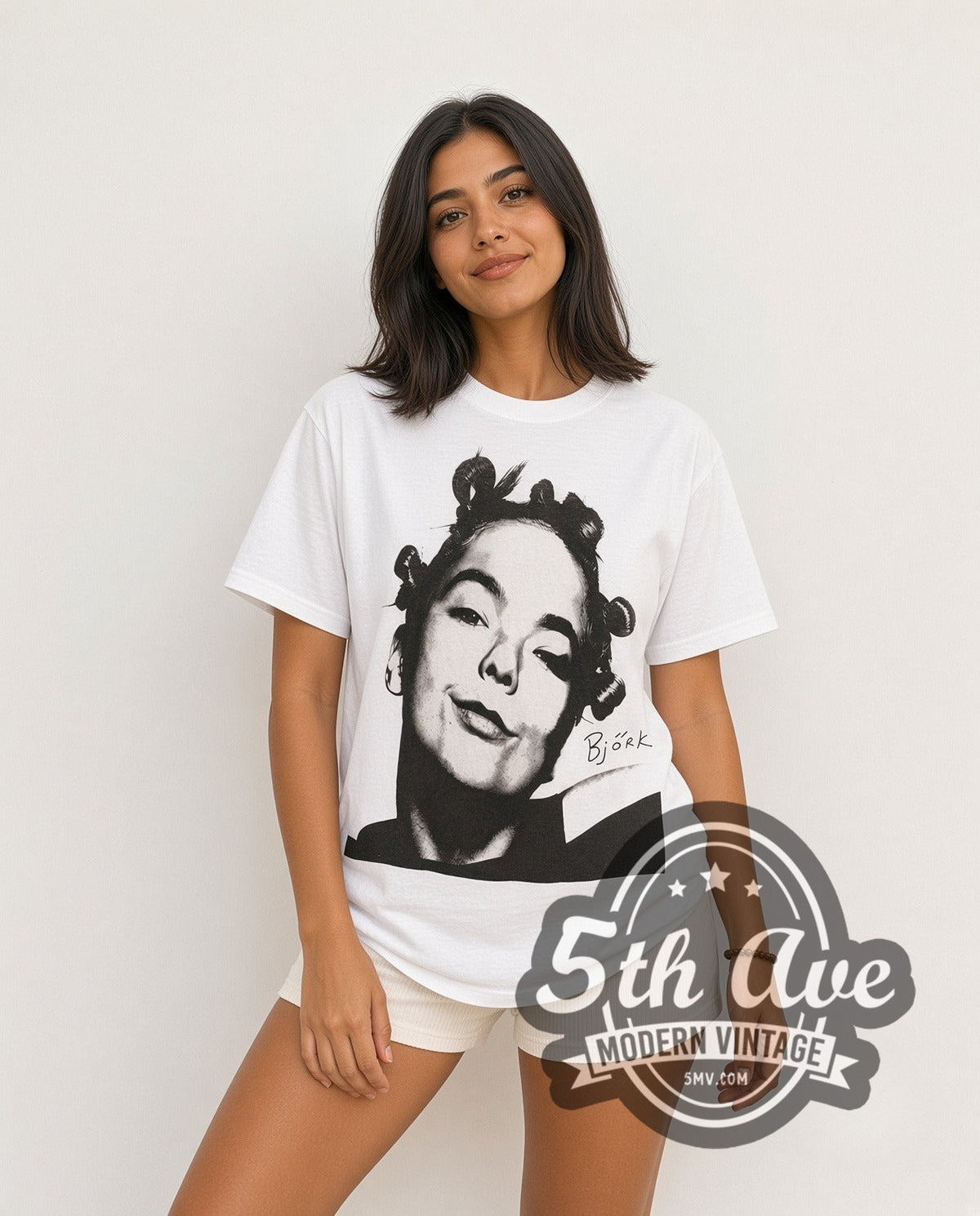 Model wearing the Björk It Take Courage to Enjoy It vintage band t-shirt in white