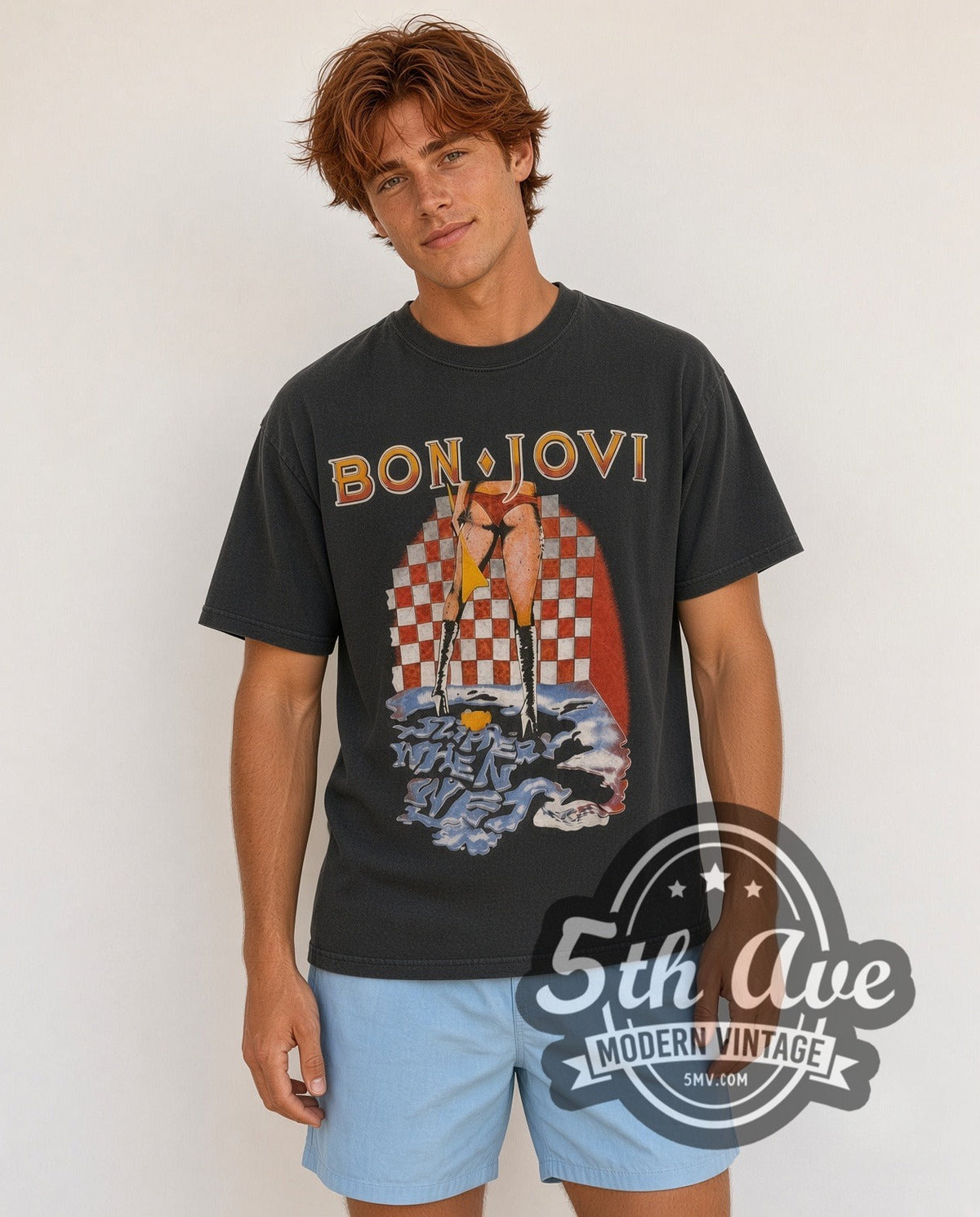 Model wearing the Bon Jovi Slippery When Wet / Let It Rock 1986 vintage band t-shirt in black