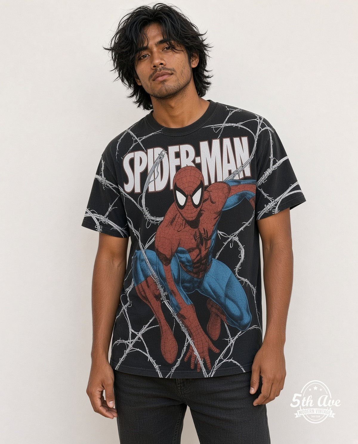 Model wearing the Spider-Man crouching pose all over print black t-shirt