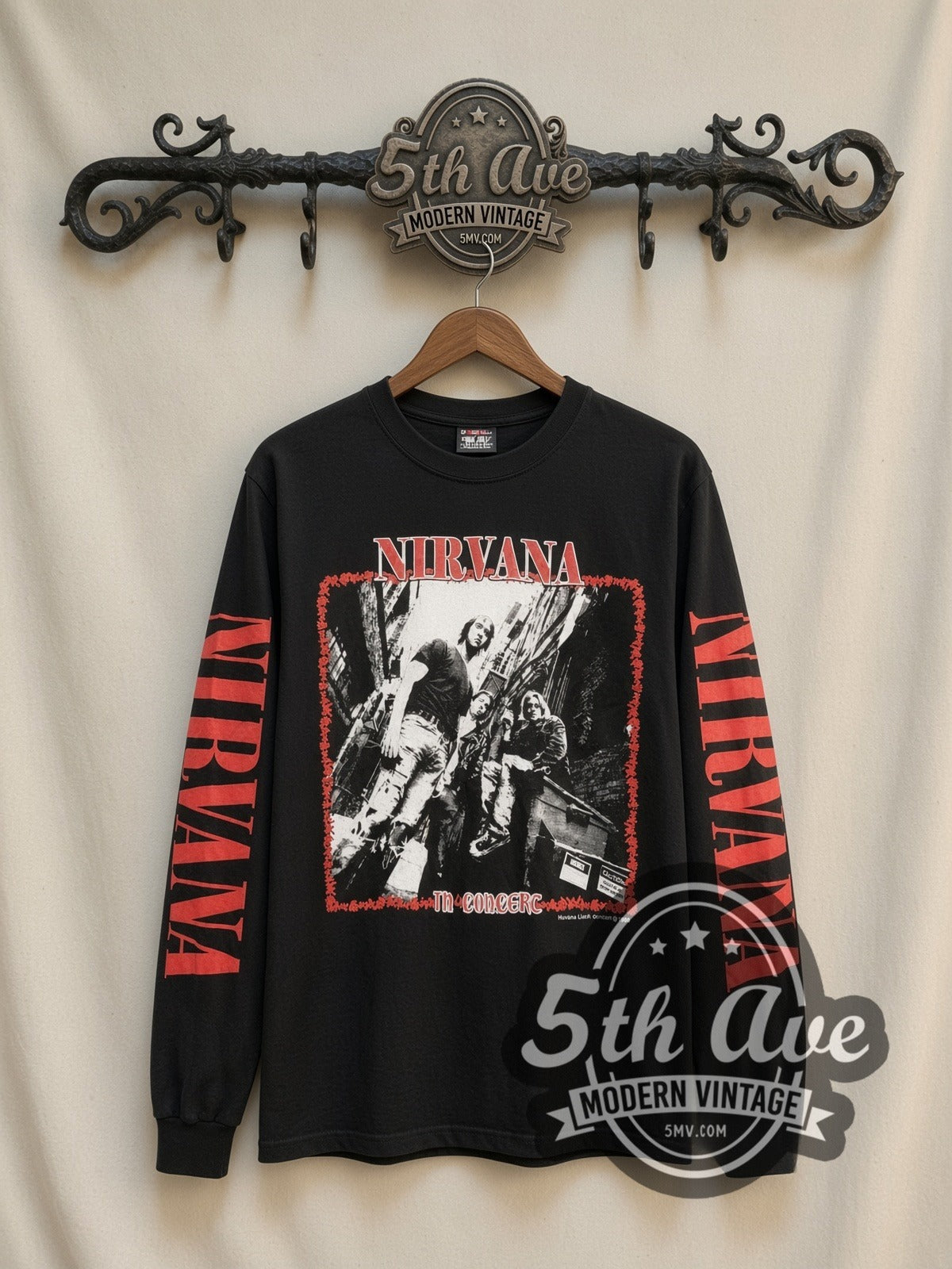 Nirvana In Concert vintage band long sleeve t-shirt, front view on a display rack