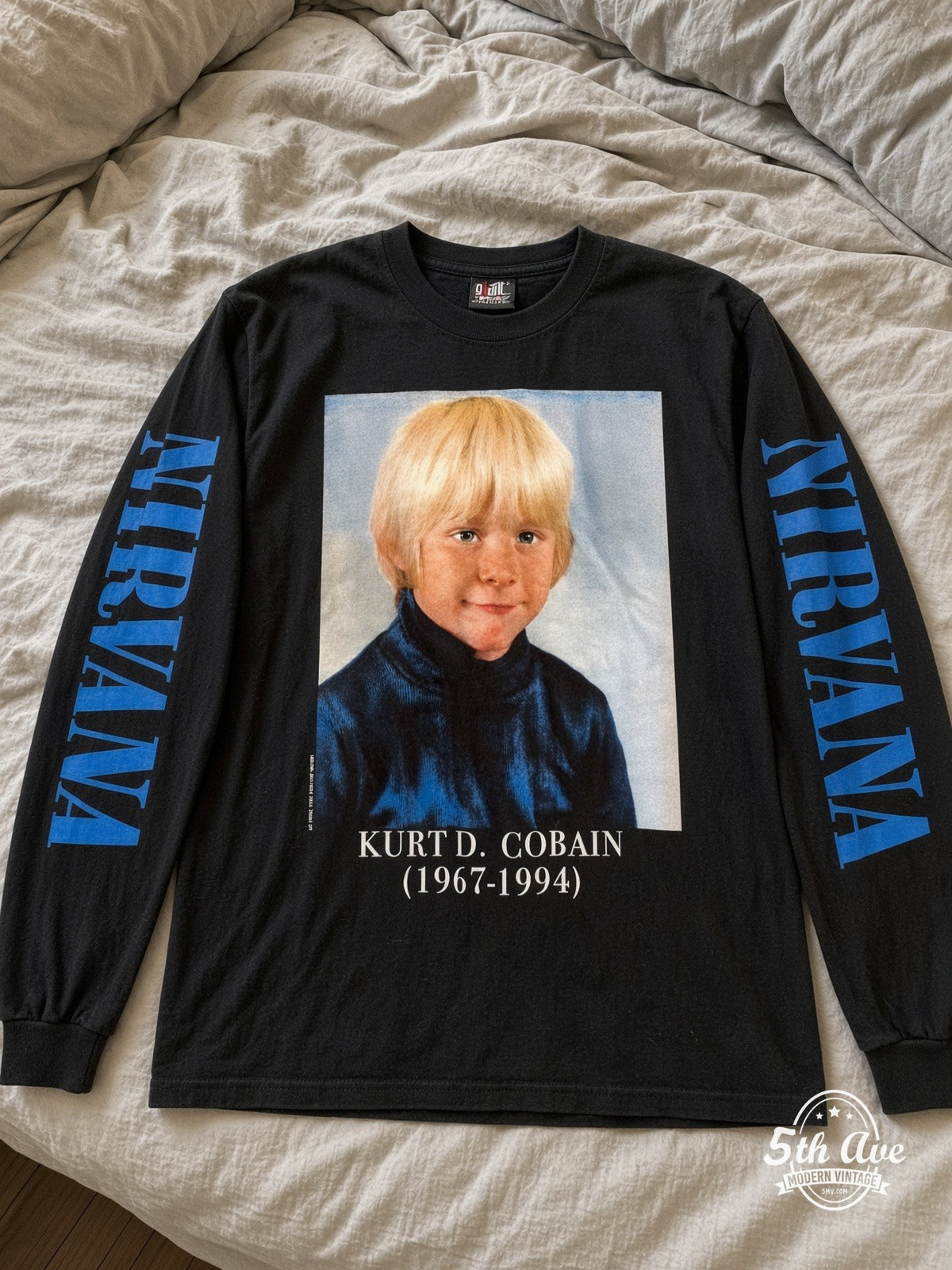 ETS LS 58 Nirvana Kurt D. Cobain 1967-1994 Childhood long sleeve vintage tee laid on a bed