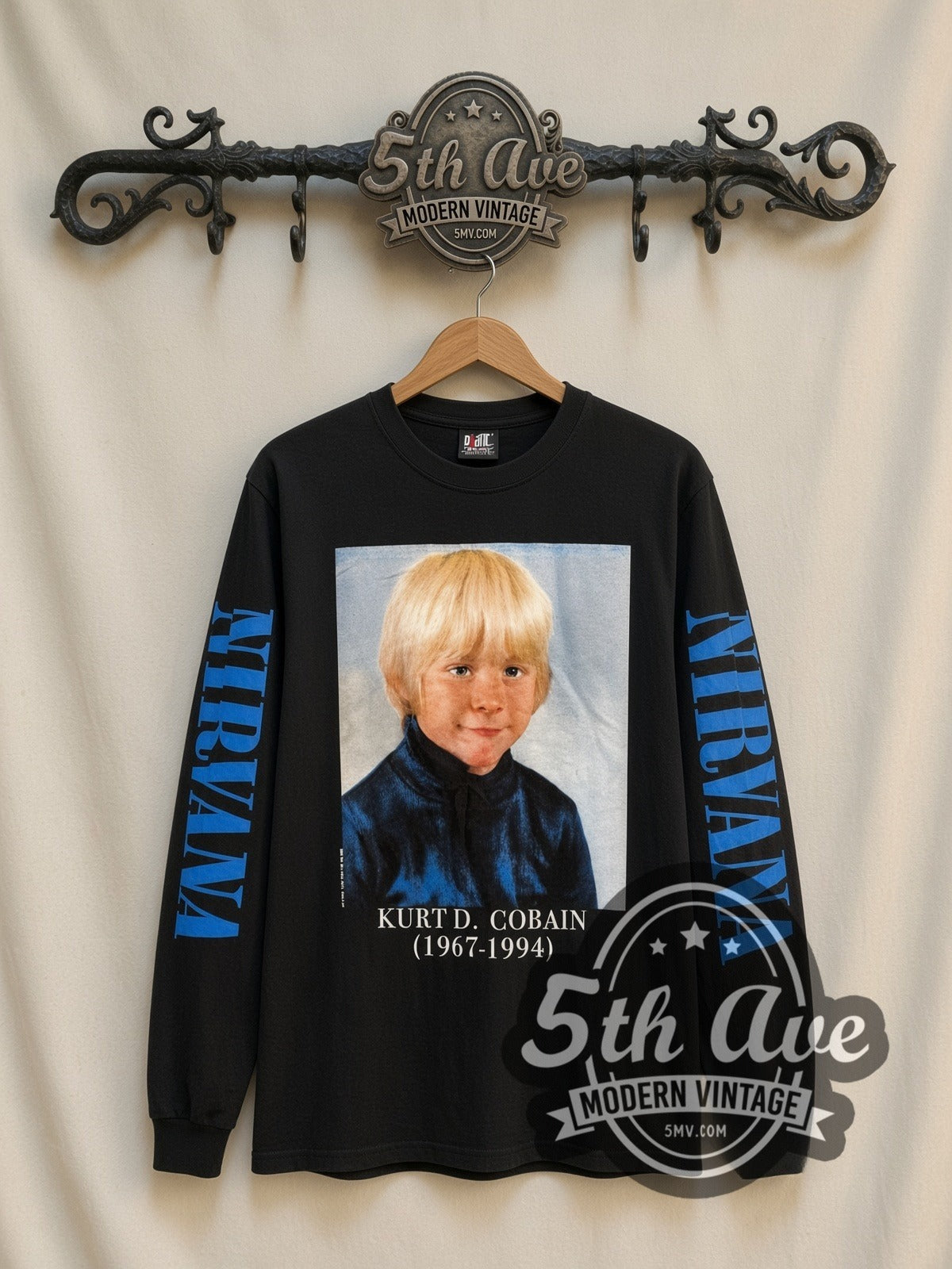 Nirvana Kurt D. Cobain 1967-1994 Childhood vintage band long sleeve t-shirt, front view on a display rack
