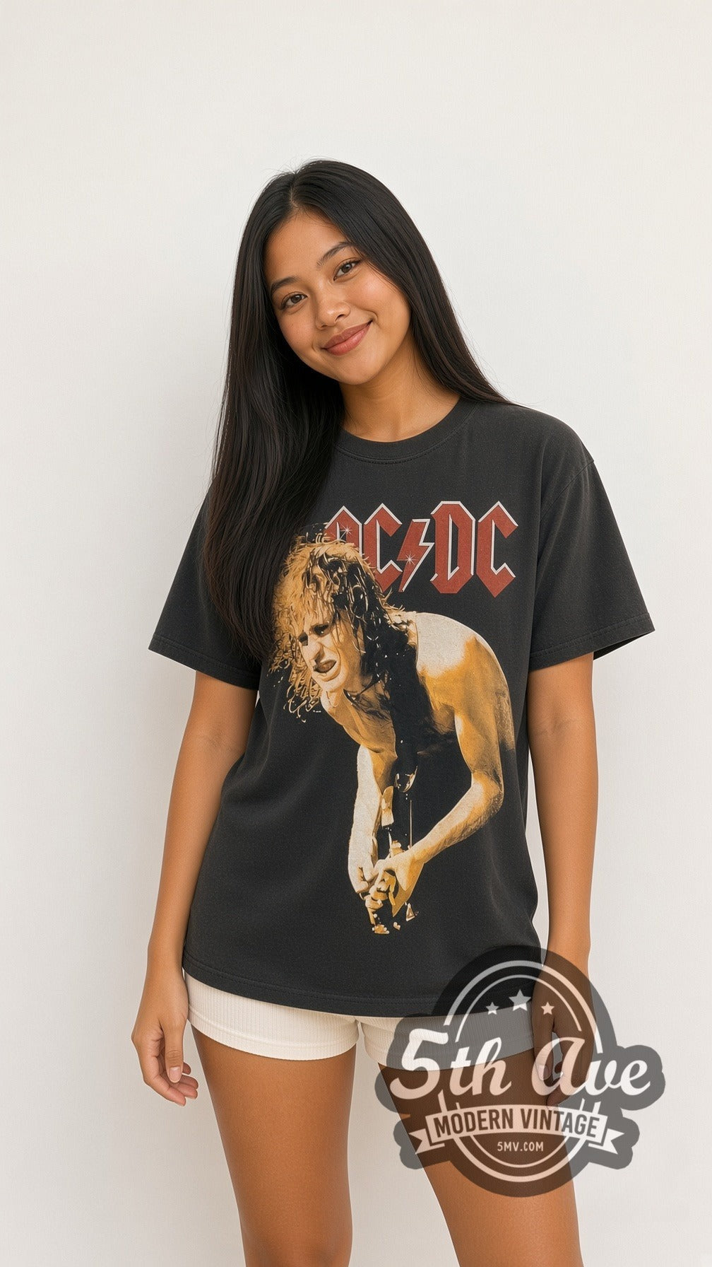 Model wearing the AC/DC Angus Young Guitar Solo all-over-print vintage band t-shirt in black