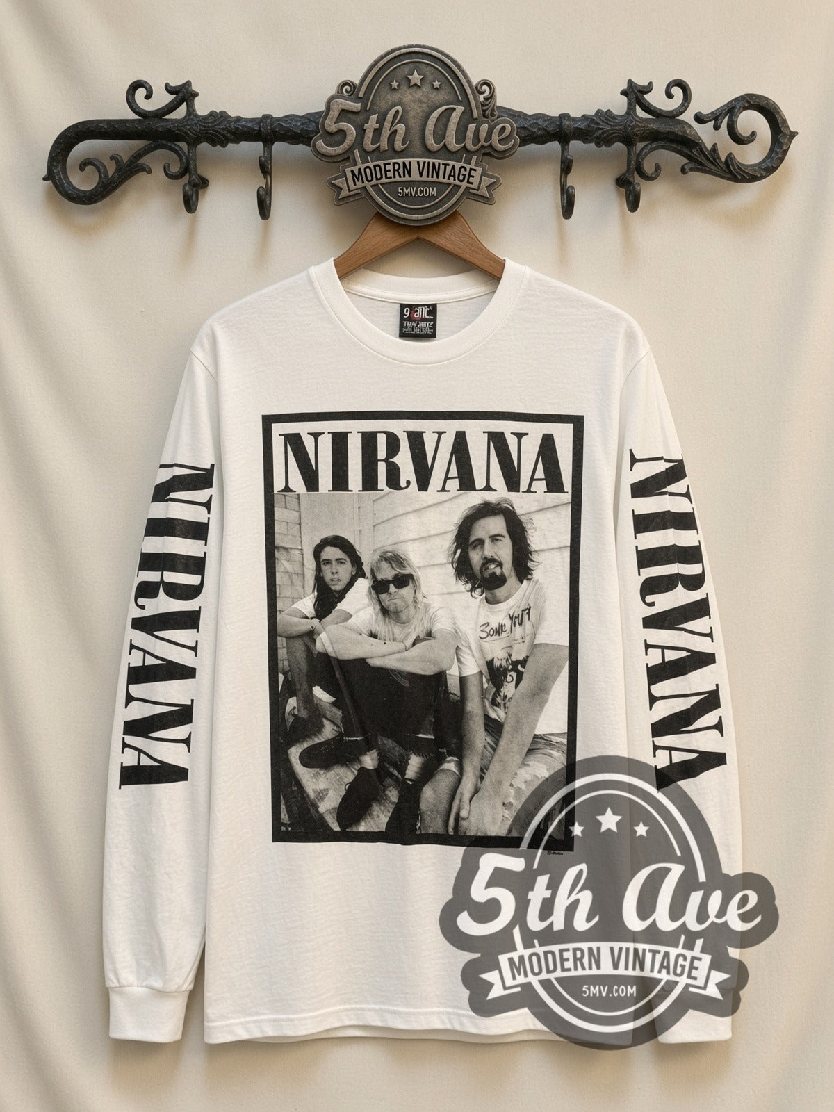 Nirvana Seated Trio vintage band long sleeve t-shirt, front view on a display rack