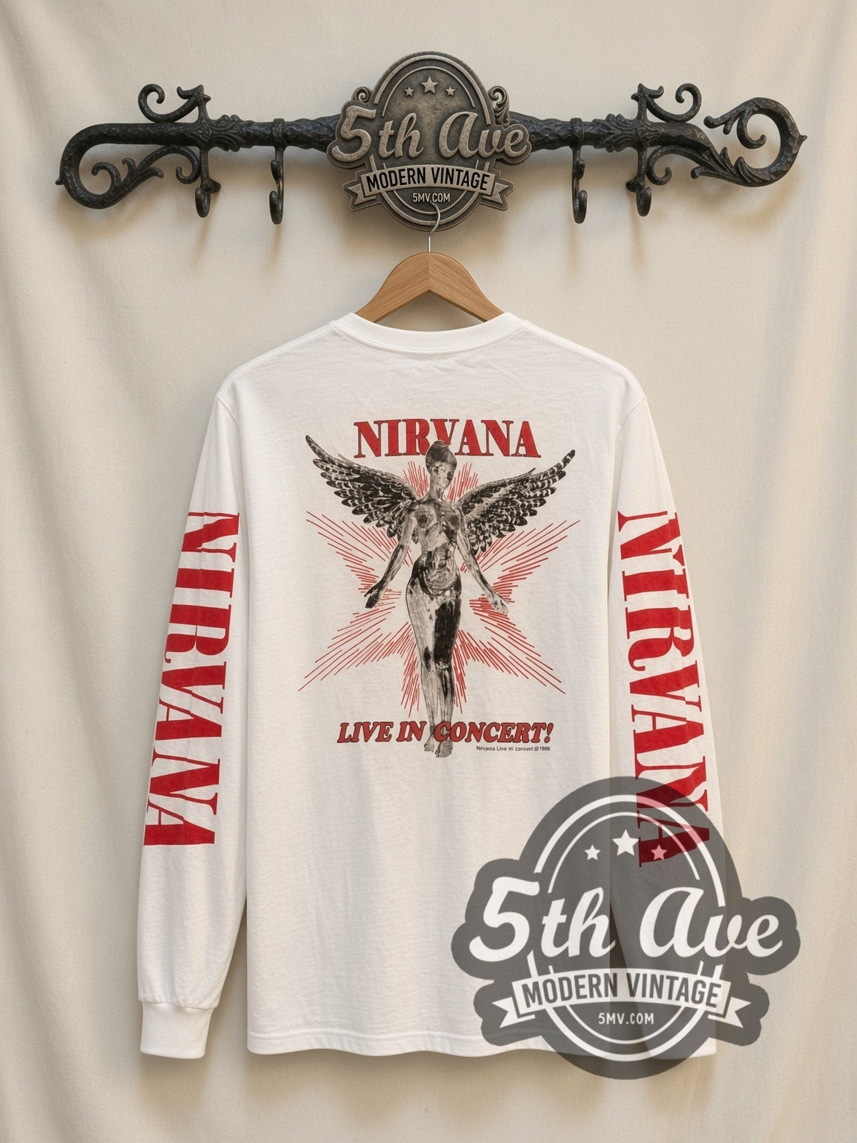 Nirvana In Concert vintage band long sleeve t-shirt in white, back view on a display rack