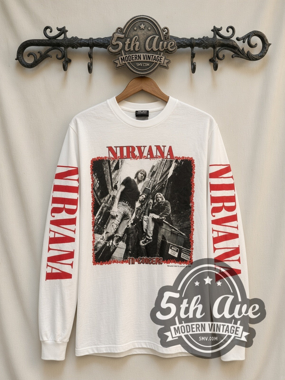 Nirvana In Concert vintage band long sleeve t-shirt in white, front view on a display rack