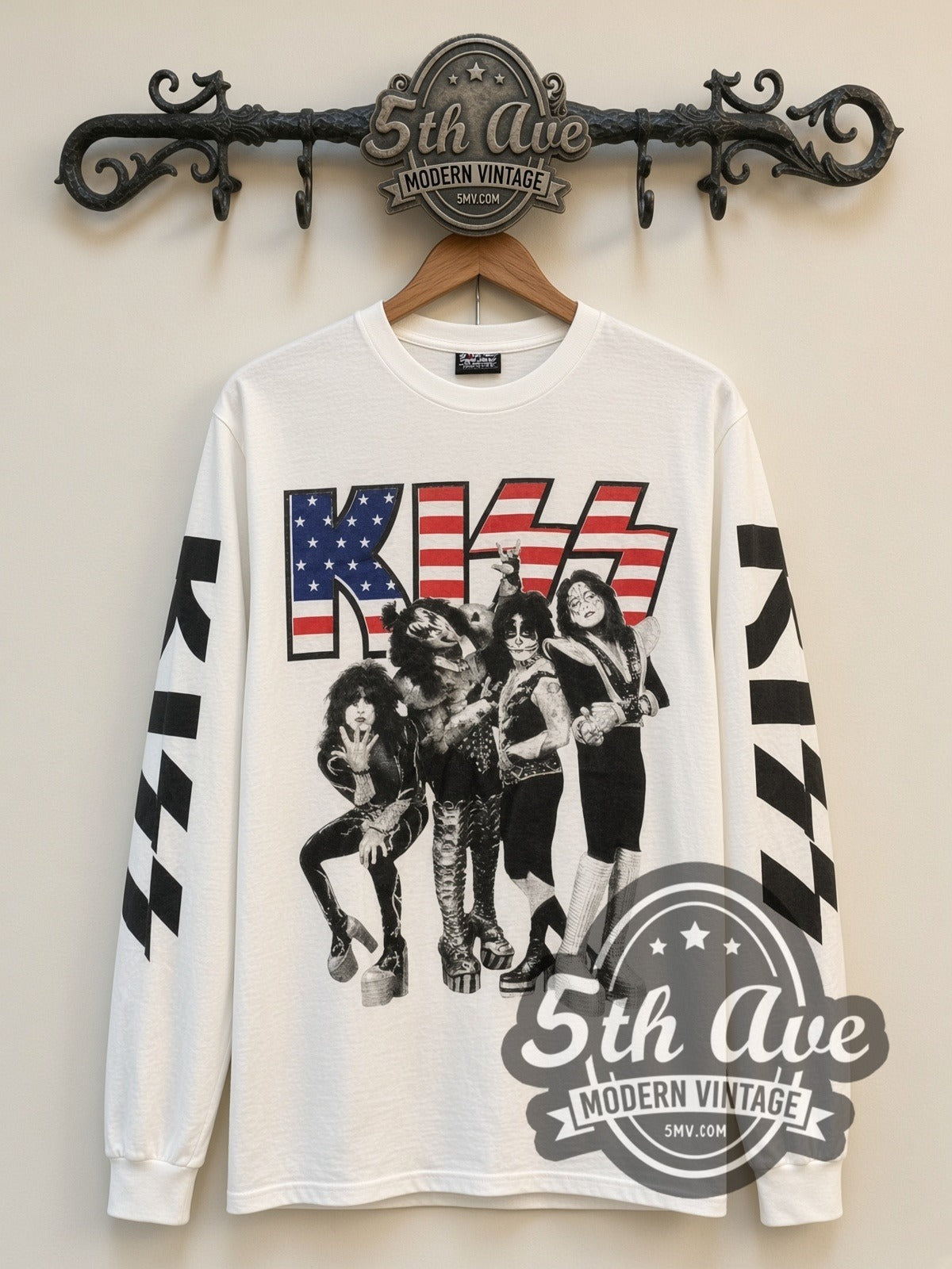 KISS Flag Logo Band vintage band long sleeve t-shirt, front view on a display rack