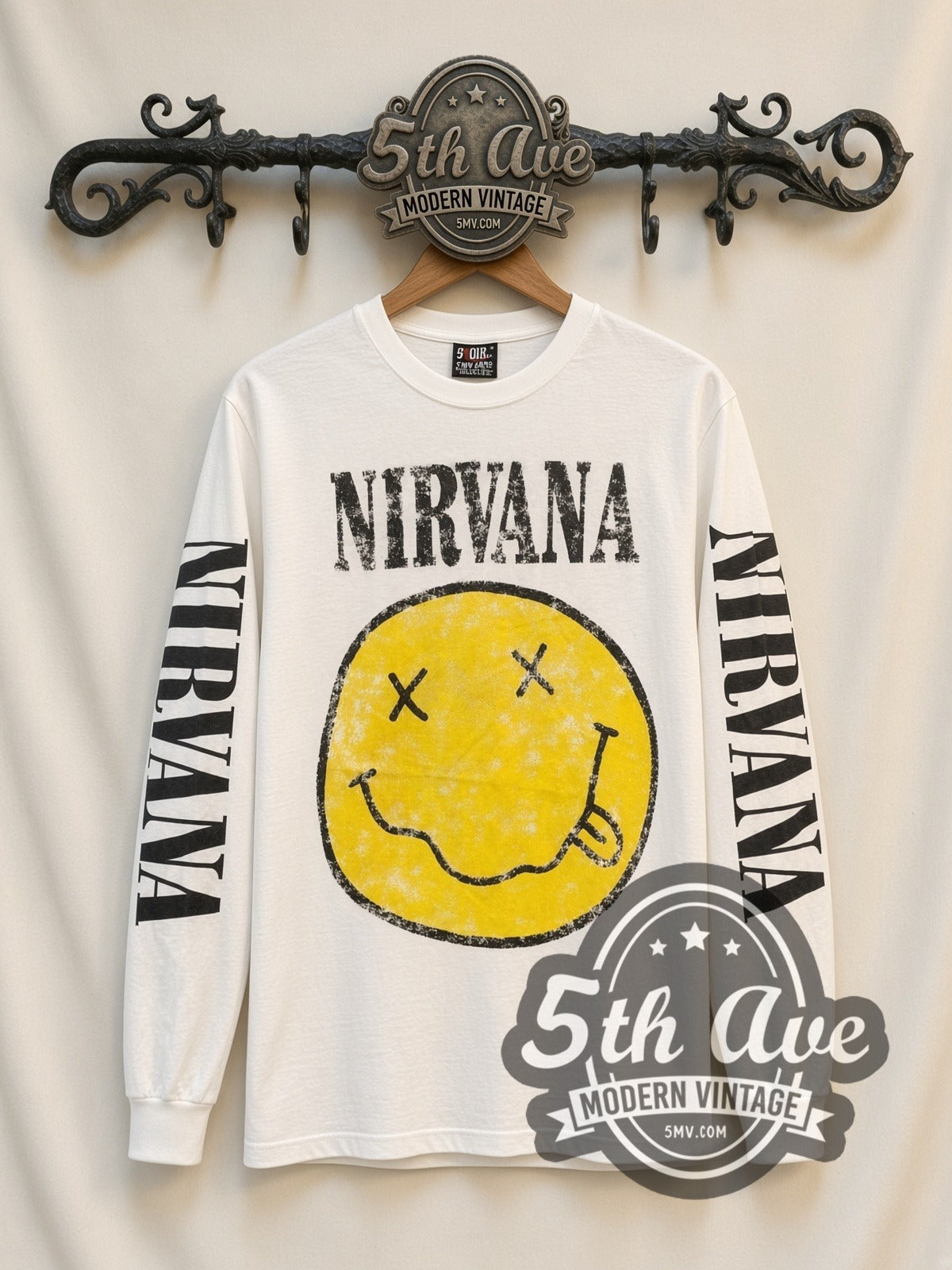 Nirvana Smiley vintage band long sleeve t-shirt, front view on a display rack