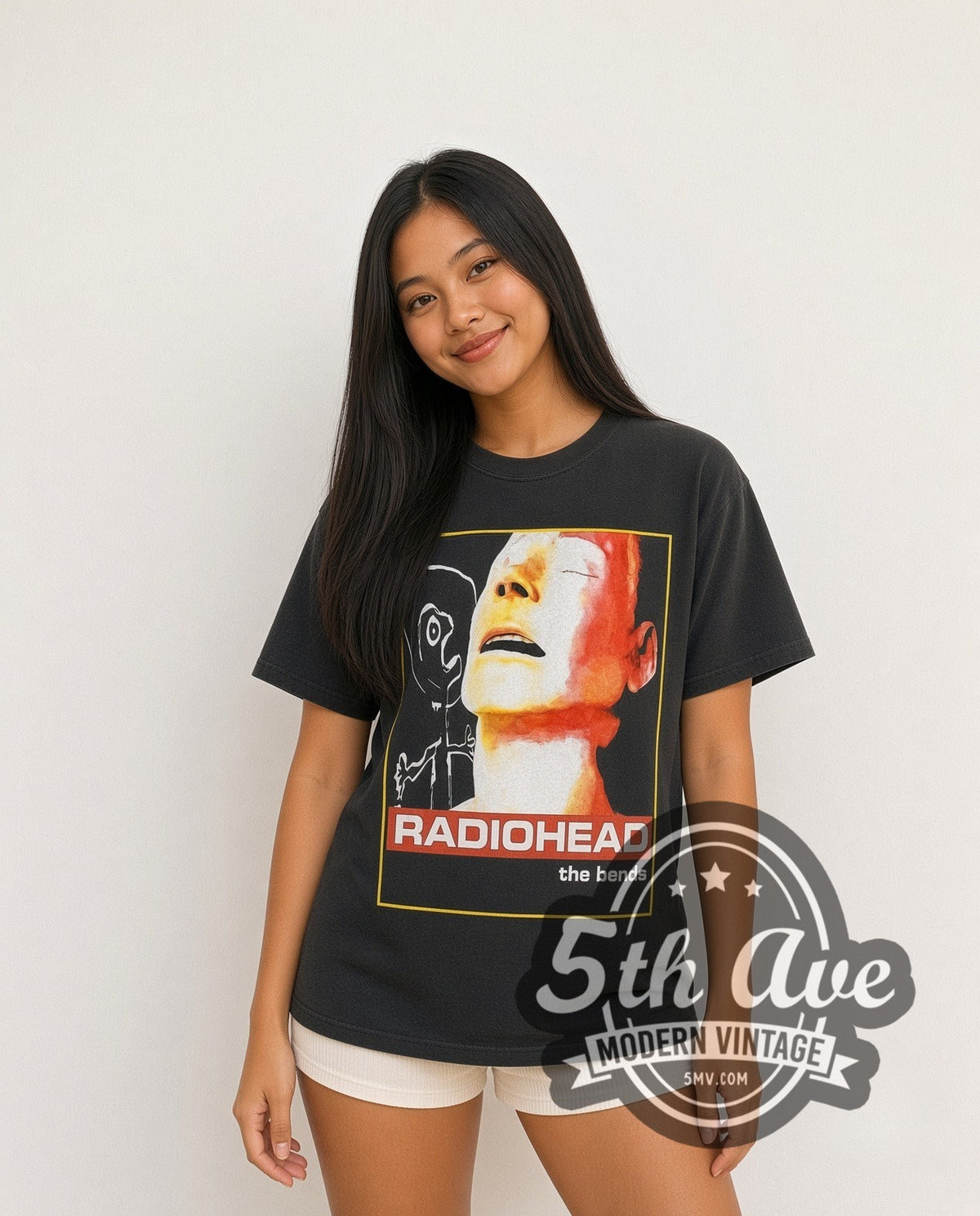 Model wearing the Radiohead The Bends Mannequin Face Tracklist vintage band t-shirt in black