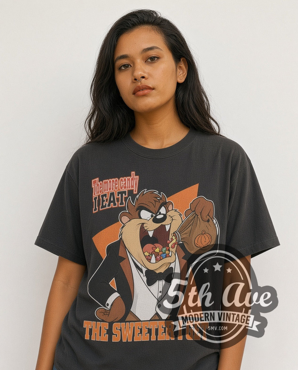 Model wearing the Looney Tunes Taz-Mania The More Candy I Eat vintage cartoon tee in black