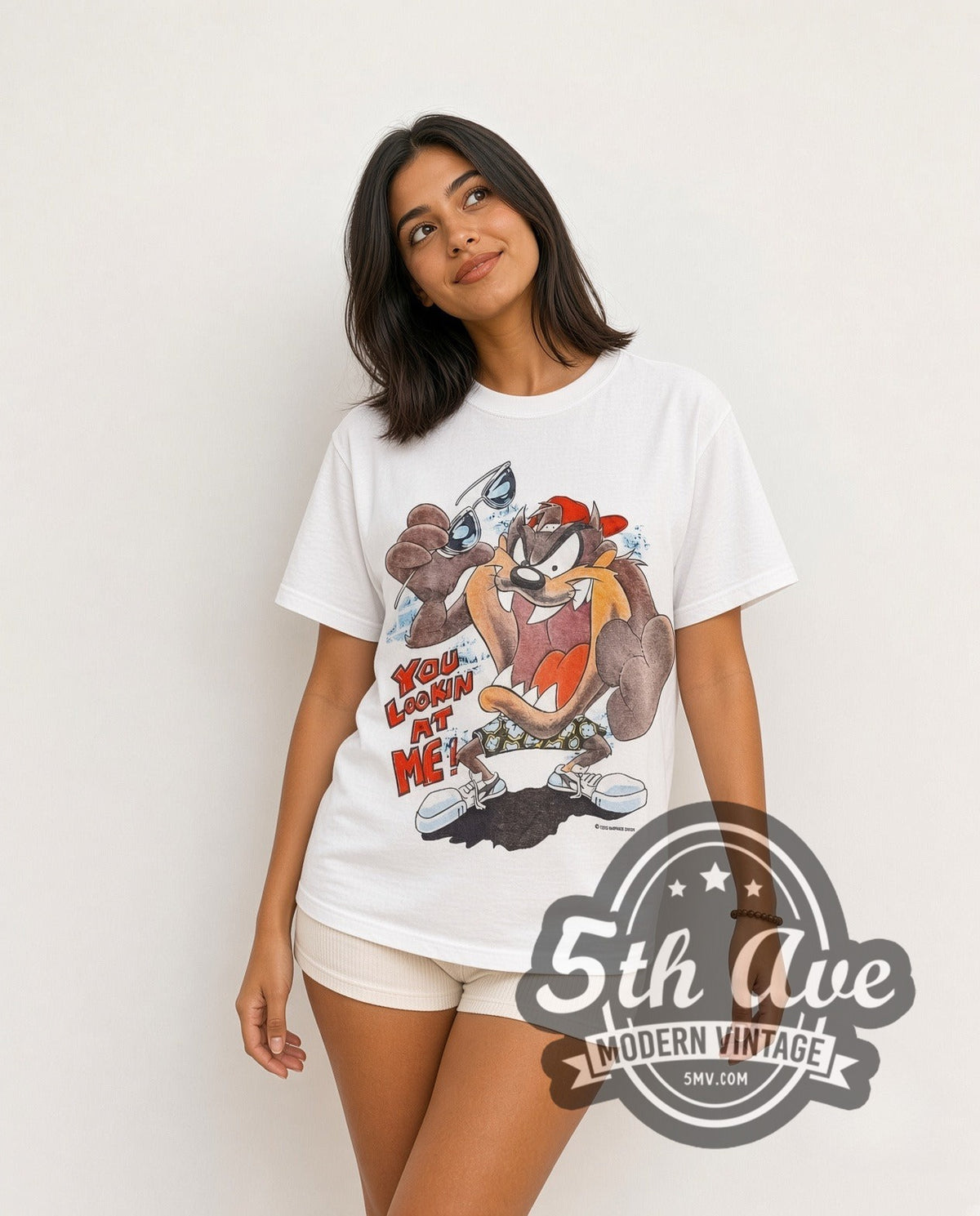 Model wearing the Looney Tunes Taz-Mania Skateboard vintage cartoon tee in white