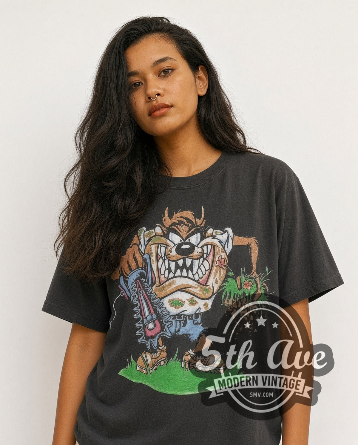 Model wearing the Looney Tunes Taz-Mania Landscaping vintage cartoon tee in black