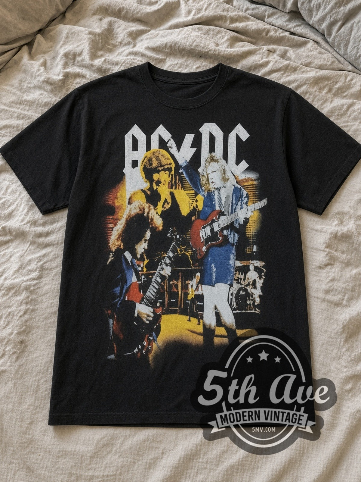 Black AC/DC Graphic Vintage Band T-Shirt laid flat on a linen bed