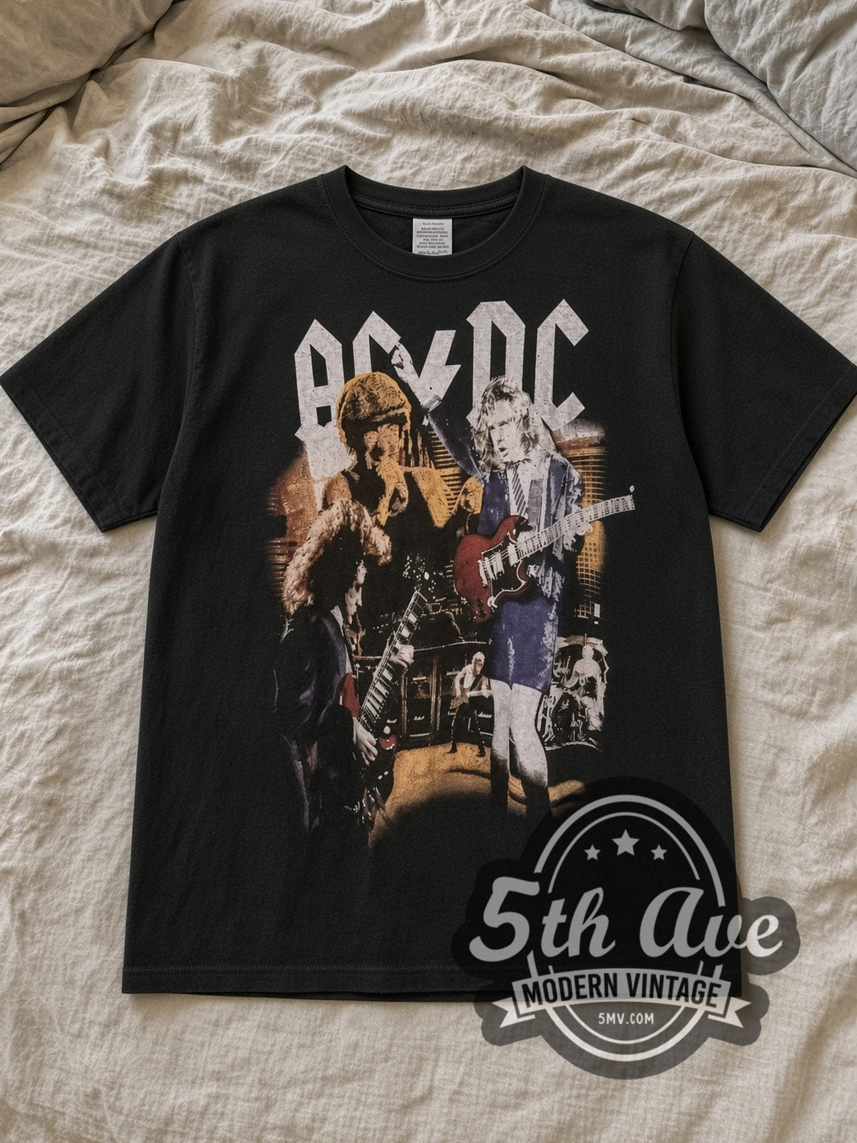 Black AC/DC Thunderstruck Live Vintage Band T-Shirt laid flat on a linen bed
