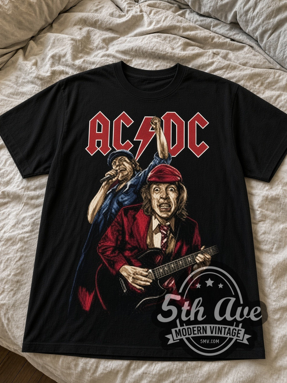 AC/DC Angus Young and Brian Johnson Live black graphic tee laid flat on linen bed