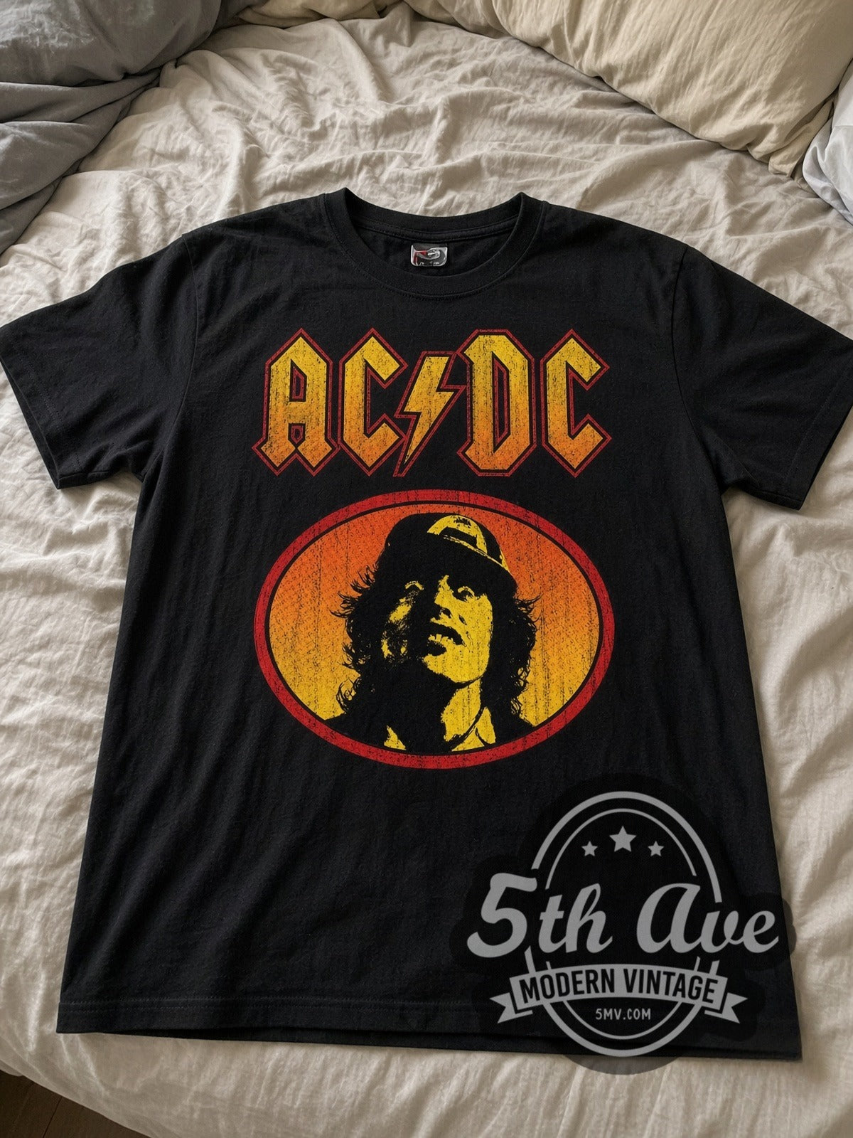AC/DC Angus Young Oval vintage band tee laid flat