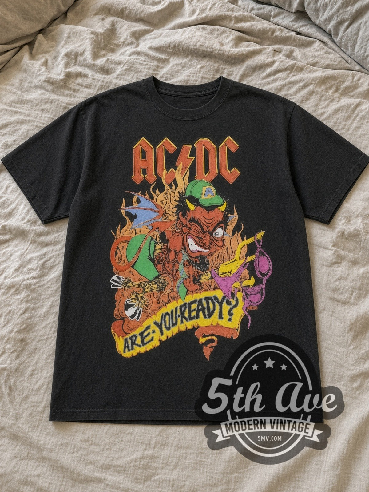 Black AC/DC Are You Ready? European Tour Vintage Band T-Shirt laid flat on a linen bed